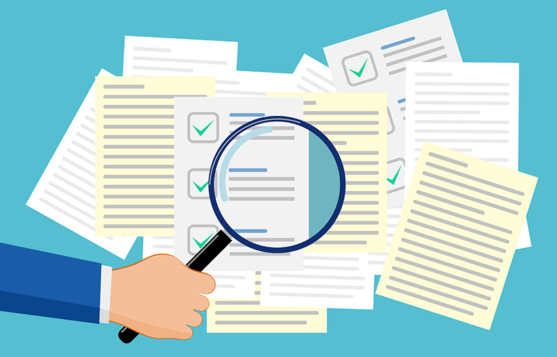 Searching through Medicaid documentation paperwork.